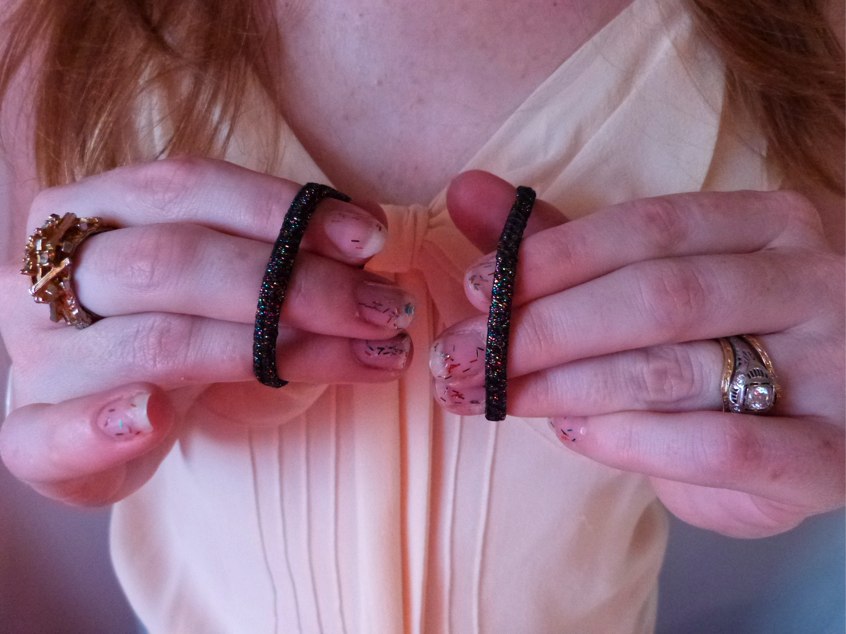 [Getting ready to put my hair up with these sparkly metallic Goody Ouchless elastics that I painted my nails to match!]
